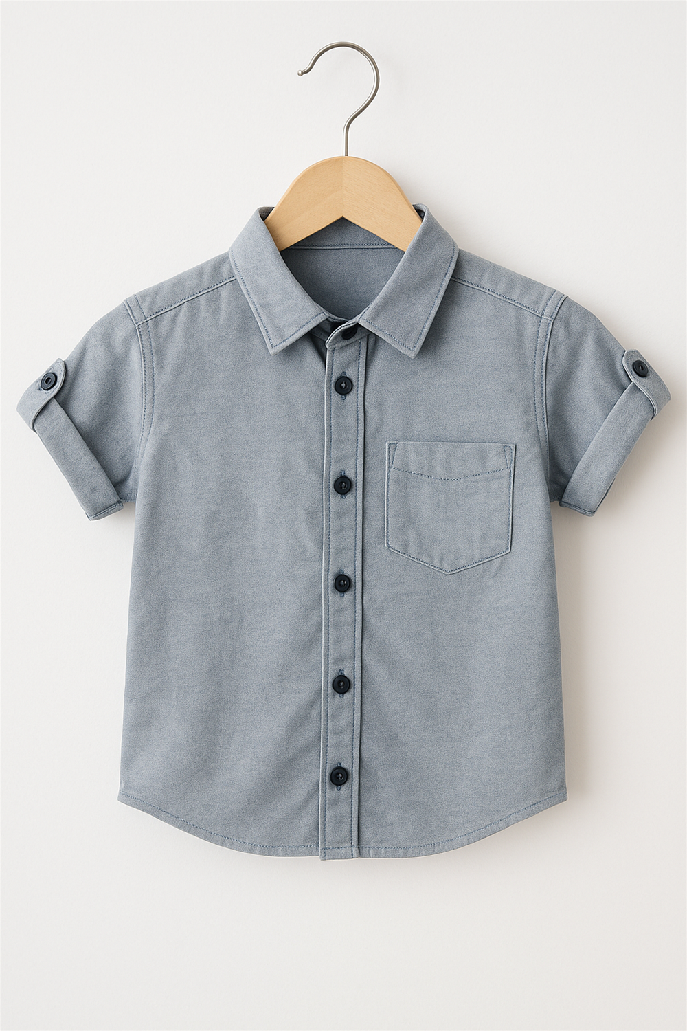 A blue half-sleeve shirt with a normal collar and buttons down the front.