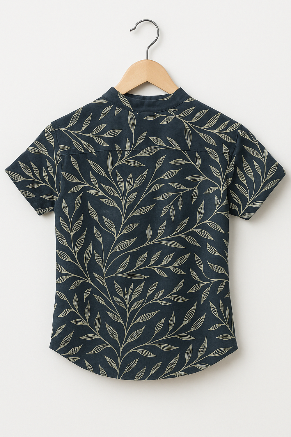 A half-sleeve shirt with a Chinese collar, featuring a leaf print design throughout the fabric.