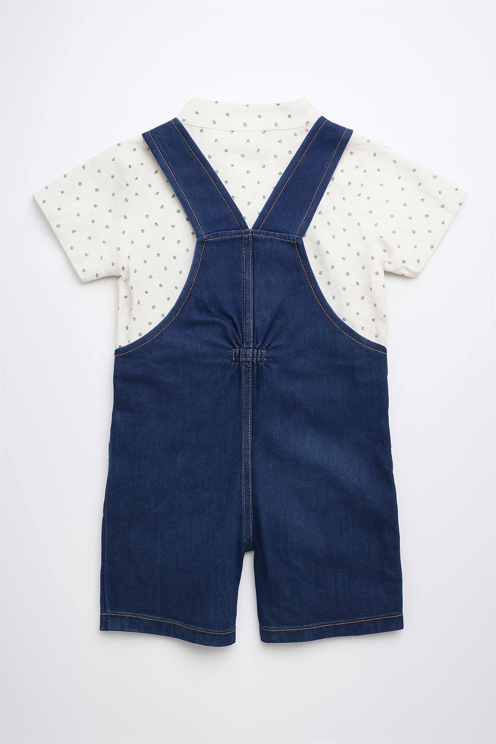 Adorable baby boy's dungaree in denim with a matching white polka dot shirt, ideal for a fun and trendy look.
