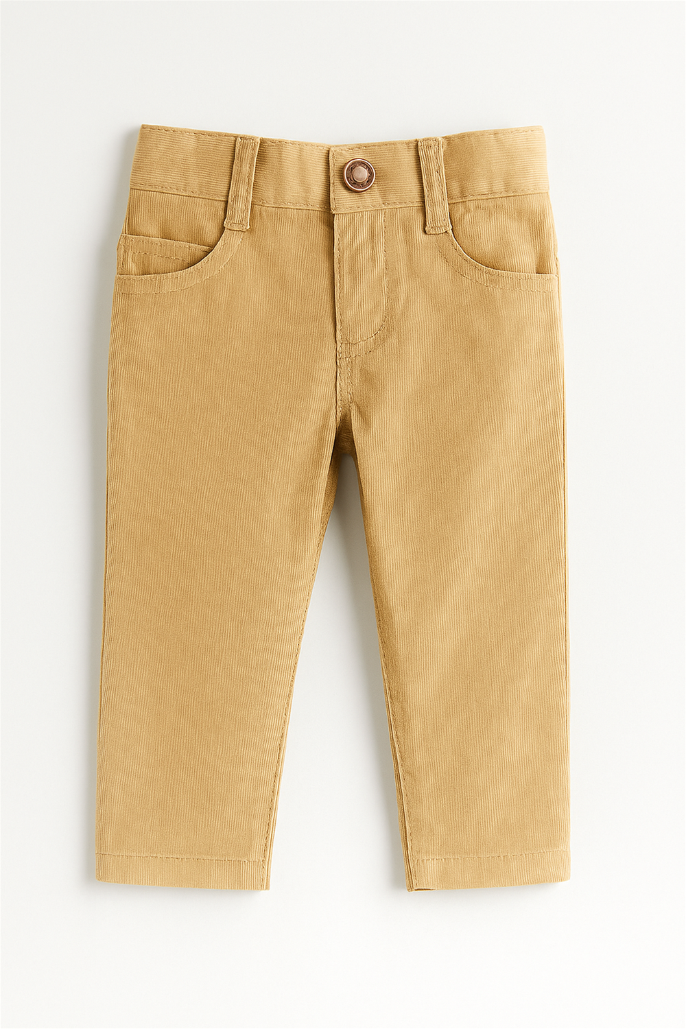 Beige corduroy toddler pants laid flat on a white background. The pants feature a classic design with front scoop pockets, a coin pocket, belt loops, and a round brown button closure at the waistband. The soft textured fabric gives a comfortable and stylish look for everyday wear.