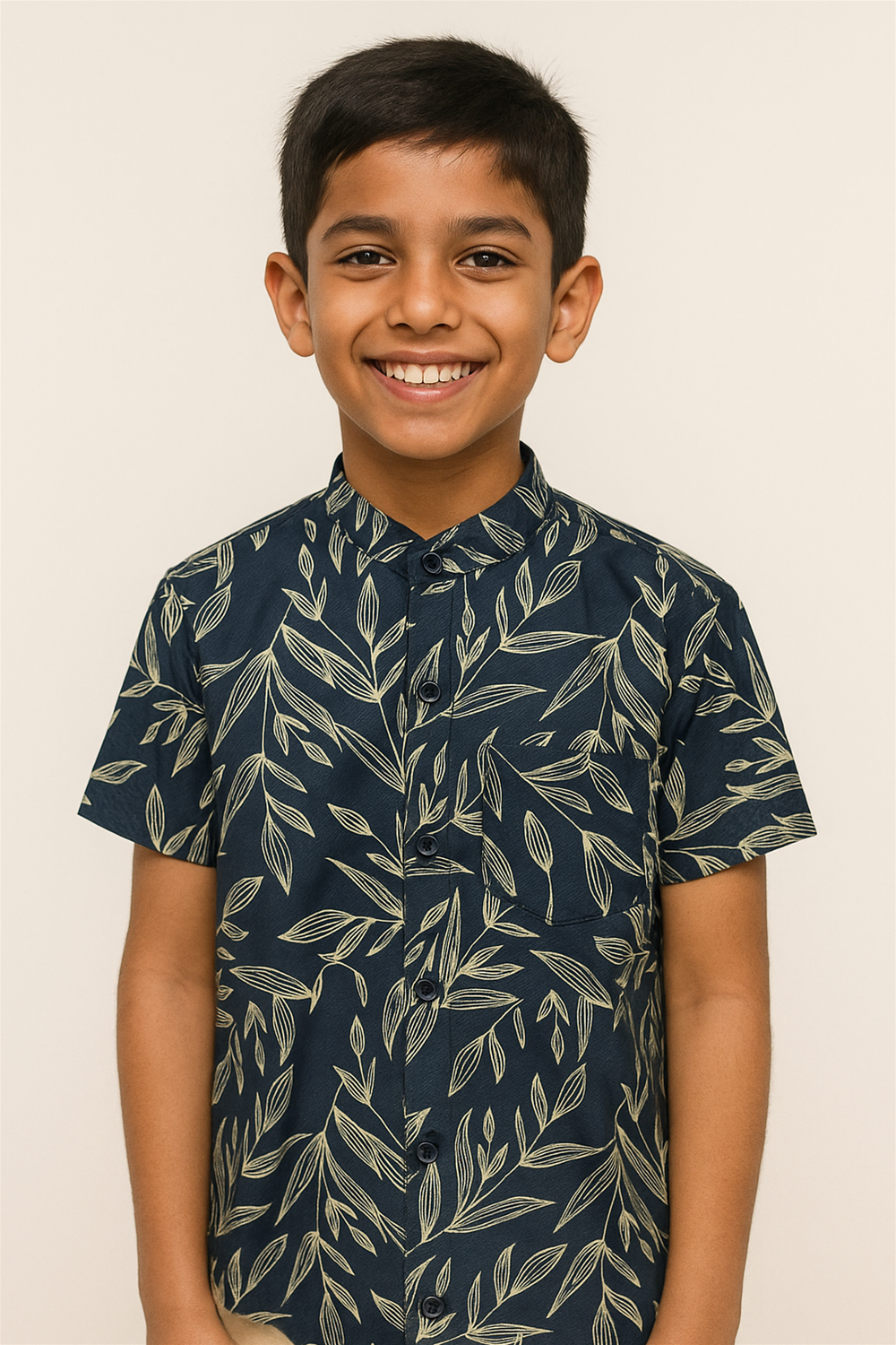 A young boy in a half-sleeve shirt with a Chinese collar, featuring a leaf pattern.