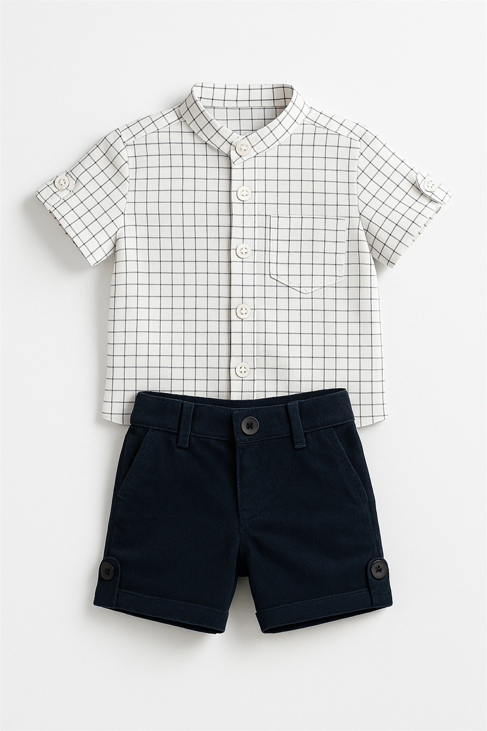 White checkered short-sleeve shirt with Chinese collar, buttoned front, chest pocket, paired with navy shorts, styled neatly.