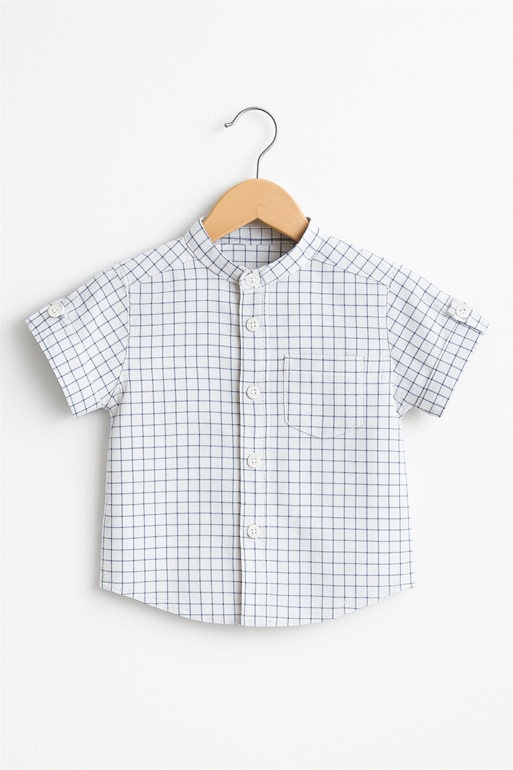 Chinese collar checkered shirt with front buttons and chest pocket, displayed on wooden hanger, crisp studio background.