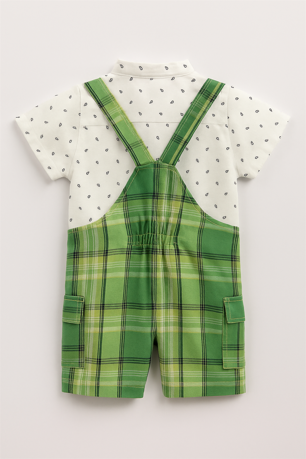A baby boy's green and white check dungaree, featuring adjustable straps and a cute pocket detail.