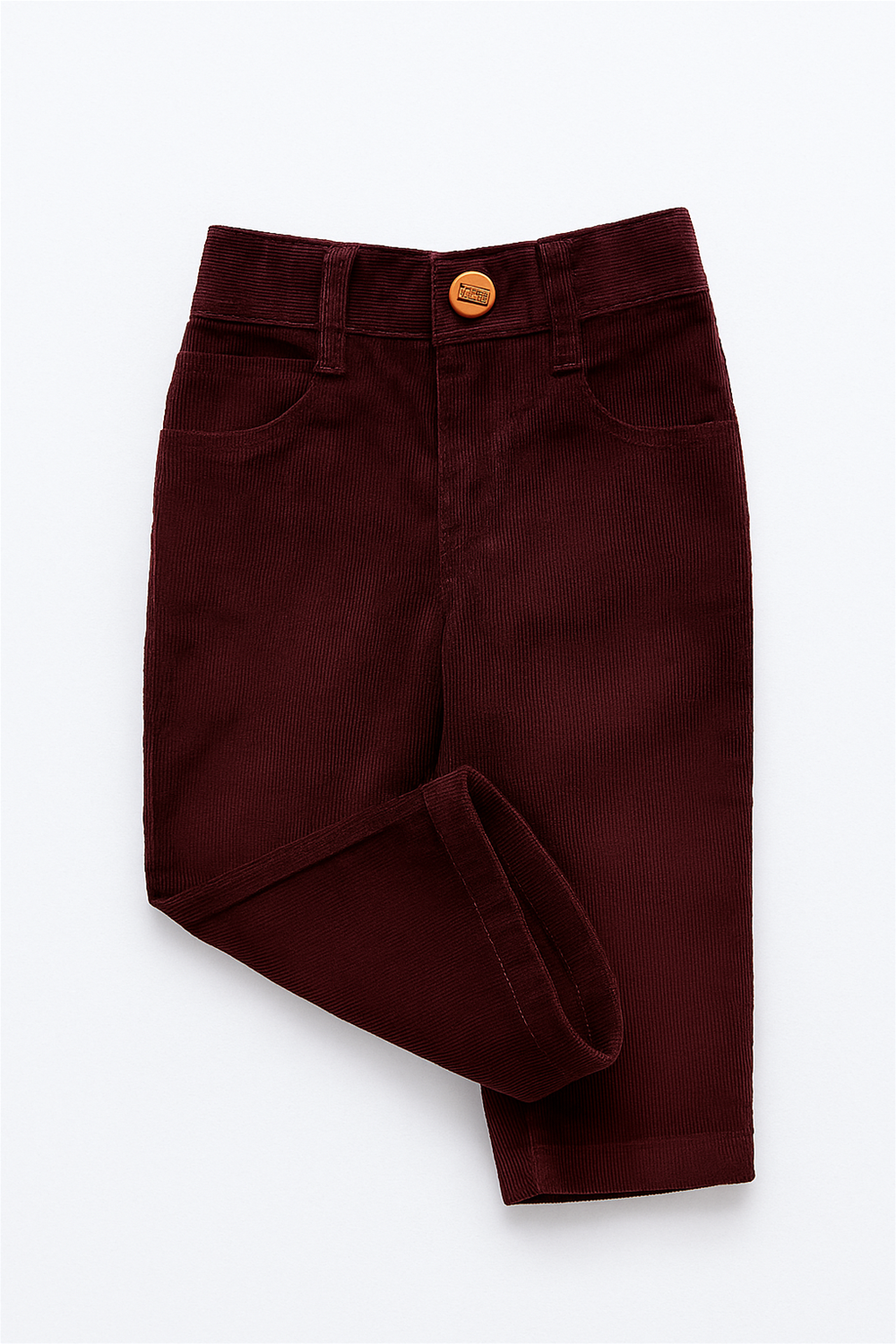 Maroon corduroy boys' full-length pants laid flat on a white background. The pants feature front scoop pockets, a coin pocket, belt loops, and a button closure at the waist. The fabric has a fine ribbed texture, giving it a soft and structured appearance.