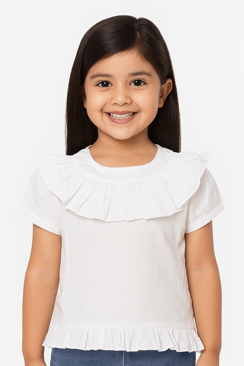 Smiling girl in white ruffle cotton top with frilled neckline and hem, paired with jeans, highlighting comfortable summer wear.