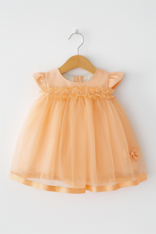 A baby girl's Peach dress featuring ruffled sleeves, perfect for warm weather and playful occasions.