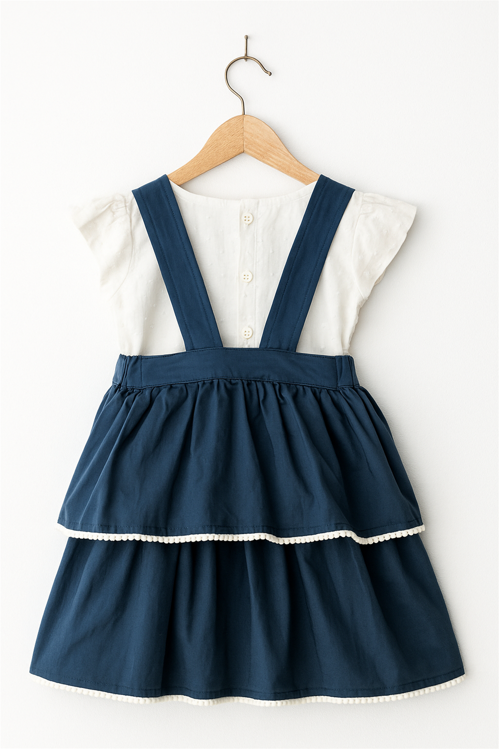 Grey blue baby girl's dress with Pom Pom lace at the layers end, showcasing a classic and elegant design suitable for various occasions.