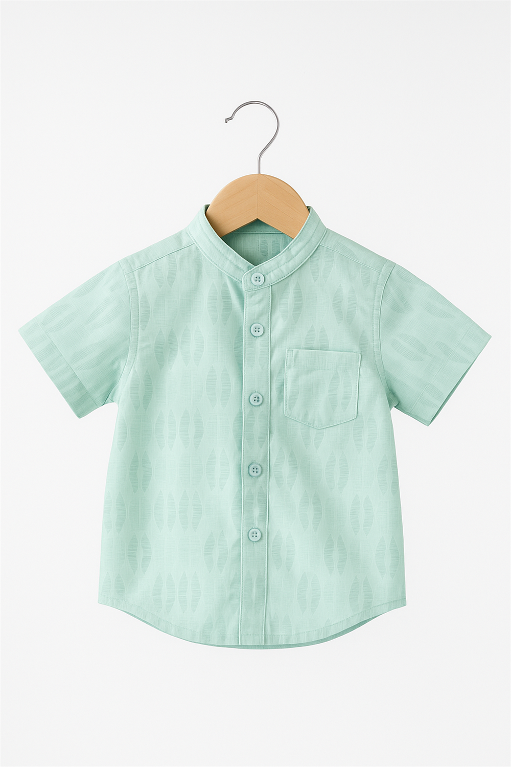 A mint green half-sleeve boys' shirt with a Chinese collar, displayed neatly on a wooden hanger. Features include a front button placket, a chest pocket, and subtle woven geometric patterns.