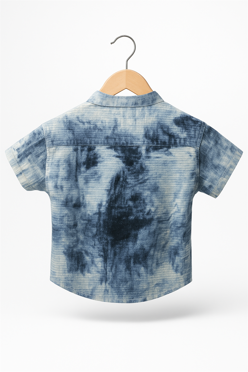 A boy's tie-dye type of design shirt with a Chinese collar and half sleeves hanging on a hanger.