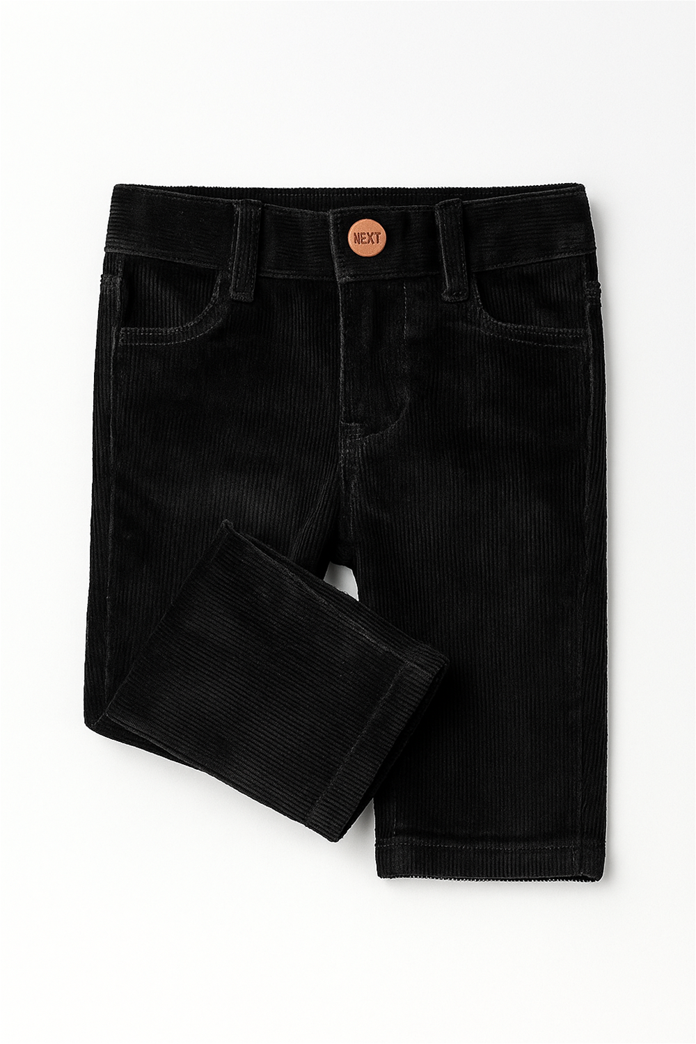 Front view of a pair of boy’s black corduroy pants featuring vertical ribbed texture, front pockets, belt loops, and a branded button closure labeled "TENDER" at the waistband, displayed flat against a white background.