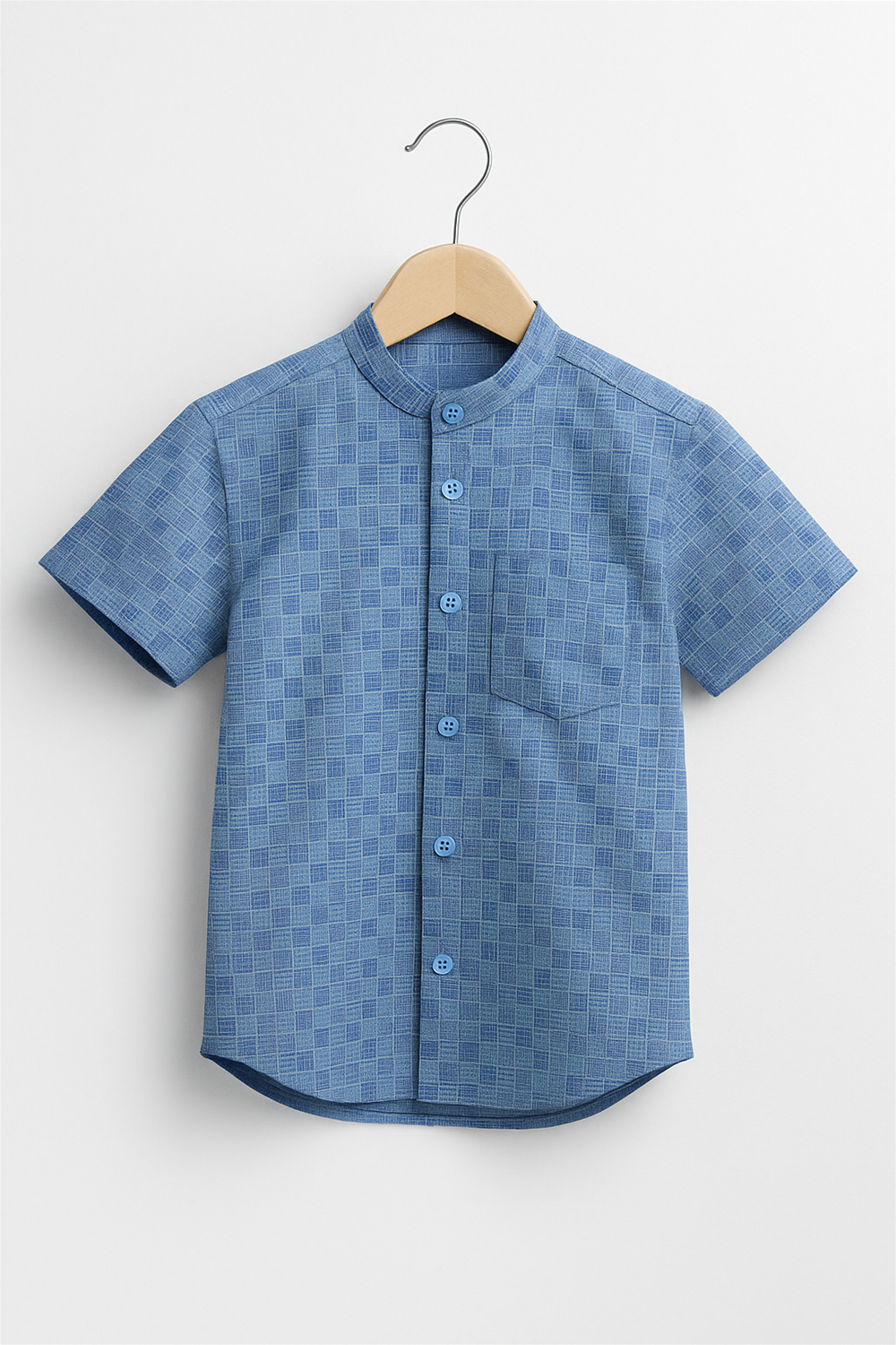 Front view of a boys' half-sleeve Chinese collar shirt in a blue grid check pattern, neatly buttoned. Displayed on a wooden hanger against a clean white background, ideal for catalog or product display.